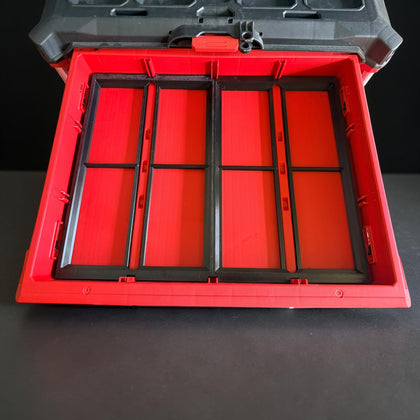 Shallow-drawer adapter seated in a Milwaukee Packout drawer with the tool box lid open above it
