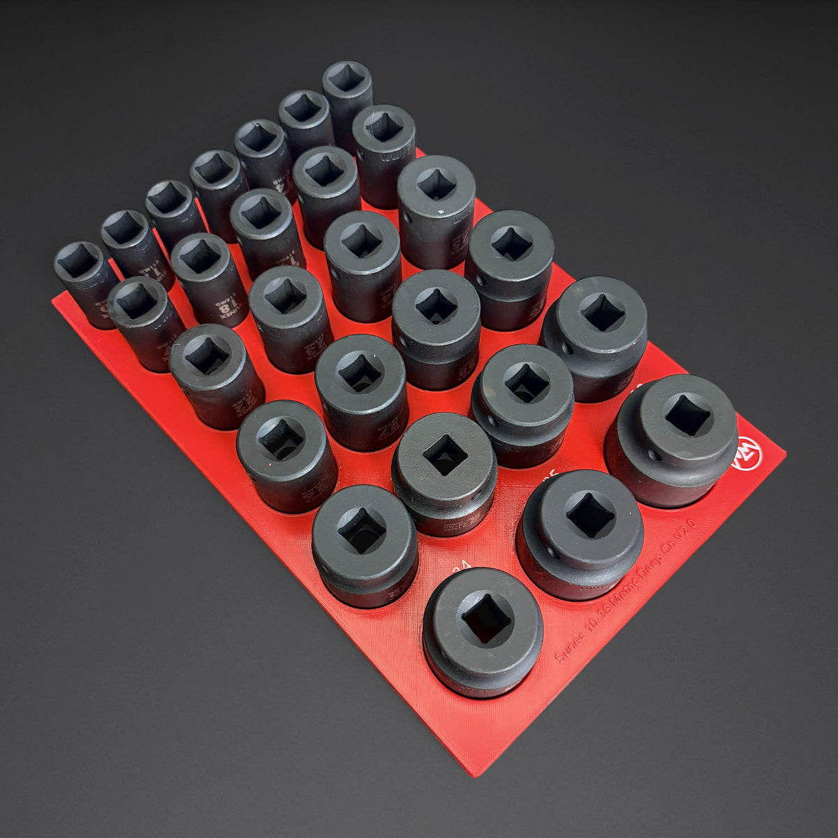 Red Mountaineer Maker deep socket organizer loaded with 27 Sunex 1/2 inch drive 6-point metric deep impact sockets, 10mm to 36mm, held upright by the support lid
